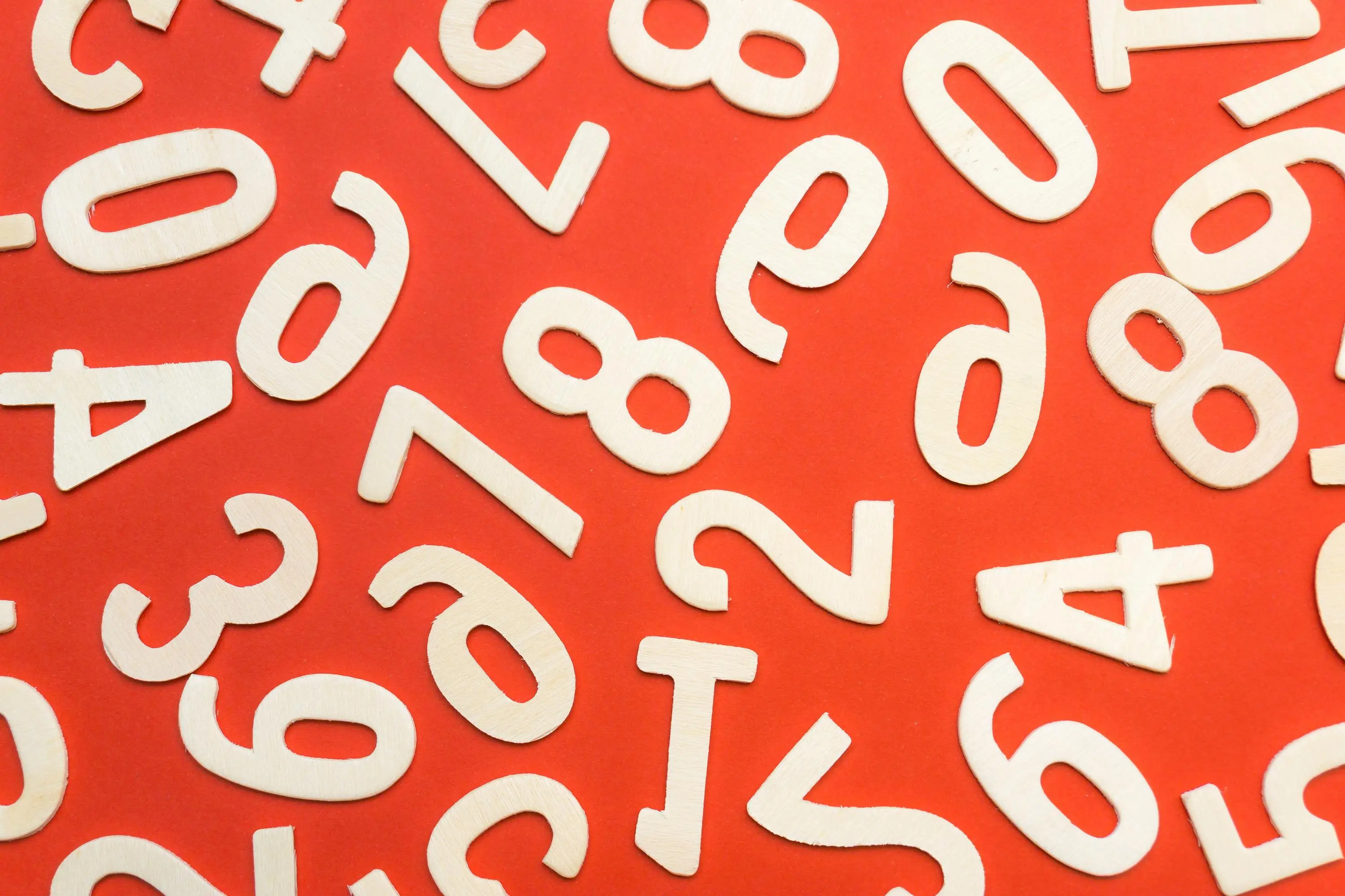 Image of numbers scattered on a red background